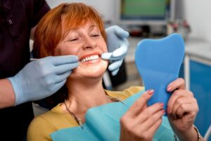 north york dentist assisting patient with dentures